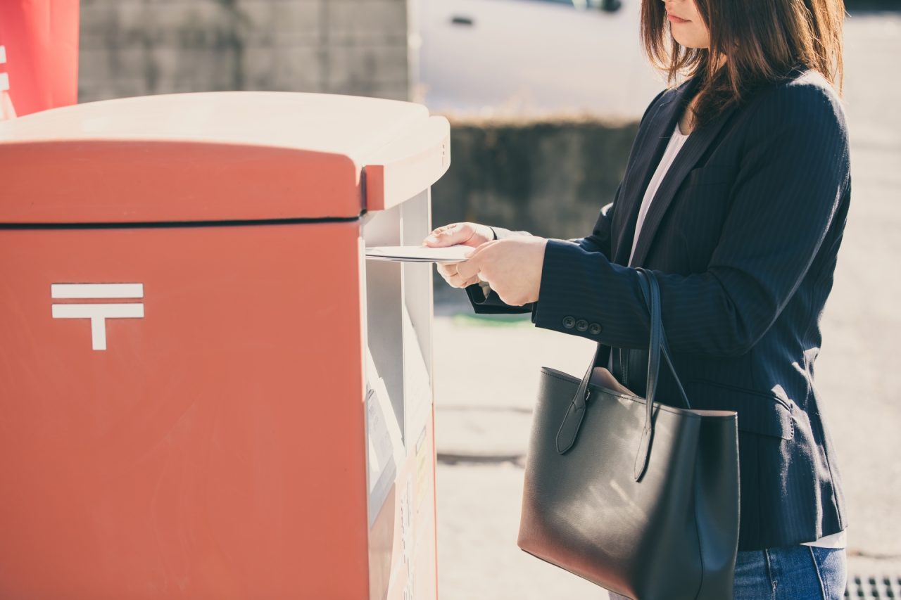 post box and woman